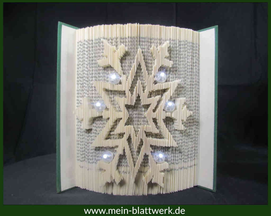 Weihnachtliche Schneeflocke in einem Buch Buchfalten-Vorlage kostenlos zum Ausdrucken.